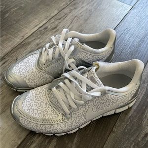 Women’s size 7 Nike snow leopard and silver